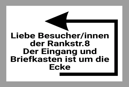 Wegweiser Briefkasten um die Ecke Bild