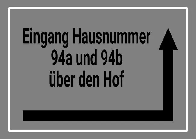 Wegweiser Eingang um die Ecke Bild