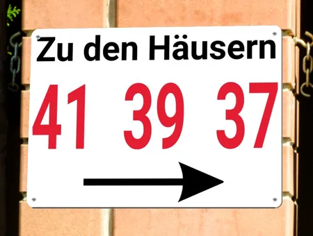 Wegweiser Zu den Häusern... Bild