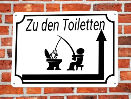 Wegweiser Zu den Toiletten Bild
